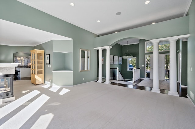 living room featuring baseboards, recessed lighting, crown molding, and carpet
