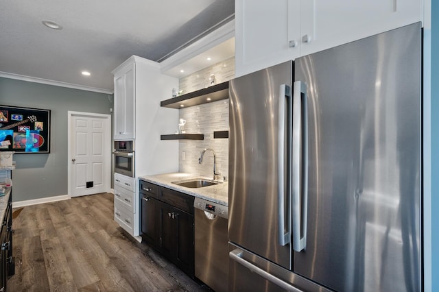 kitchen featuring a sink, stainless steel appliances, tasteful backsplash, open shelves, and white cabinets