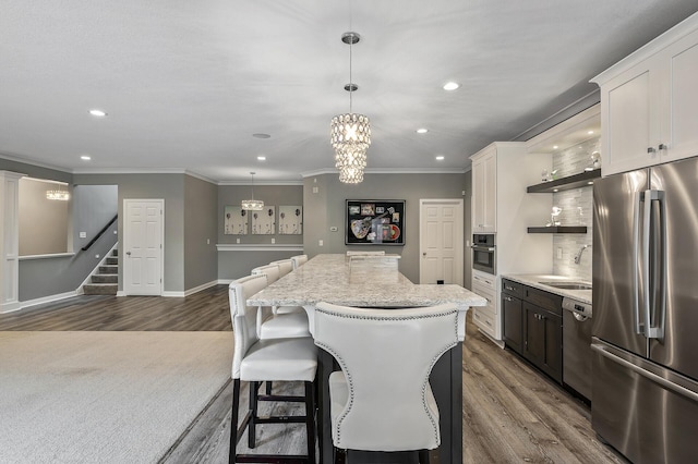 kitchen featuring a sink, open shelves, stainless steel appliances, a kitchen island, and dark wood-style floors