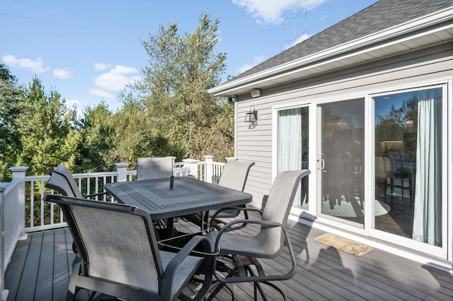 wooden deck with outdoor dining area