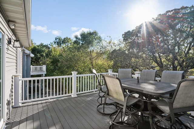 deck featuring outdoor dining area
