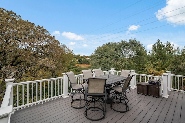 wooden terrace featuring outdoor dining area