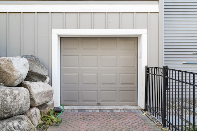garage with decorative driveway