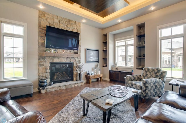 living area with a wealth of natural light and wood finished floors