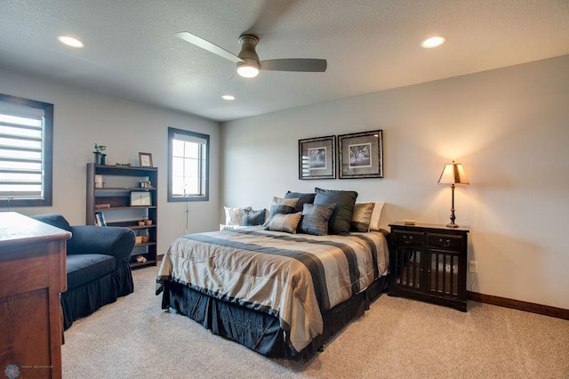 bedroom featuring light colored carpet, baseboards, and recessed lighting