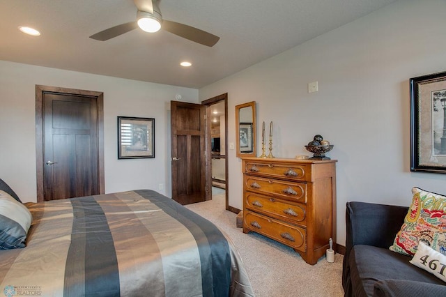 bedroom featuring a ceiling fan, light carpet, recessed lighting, and baseboards