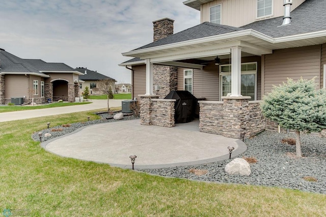 view of patio featuring cooling unit, a ceiling fan, and grilling area