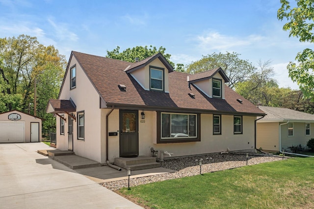 420 Ruby Dr W, Saint Paul, MN 55118 - view of front of house with an outbuilding, stucco siding, concrete driveway, a garage, and a front yard