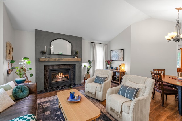 95 Olympic Cir, Chanhassen, MN 55317 - living room with wood finished floors, a chandelier, lofted ceiling, a tile fireplace, and healthy amount of natural light
