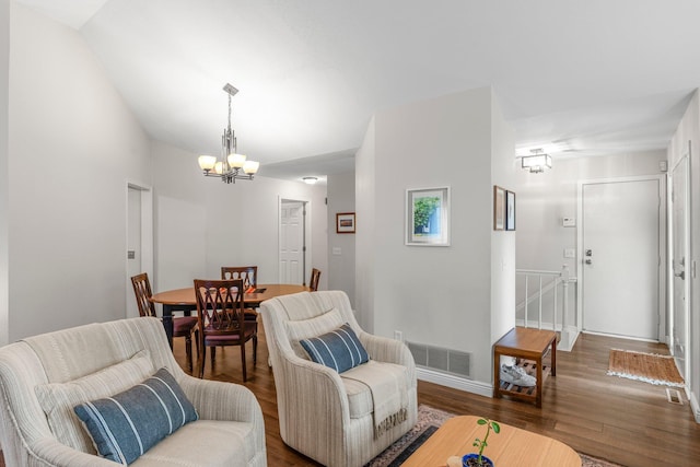 95 Olympic Cir, Chanhassen, MN 55317 - living room with a chandelier, wood finished floors, and baseboards