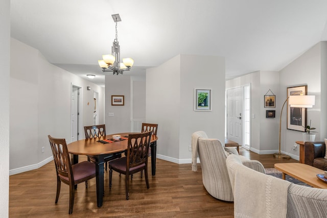 95 Olympic Cir, Chanhassen, MN 55317 - dining area featuring a chandelier, dark wood-style floors, and baseboards