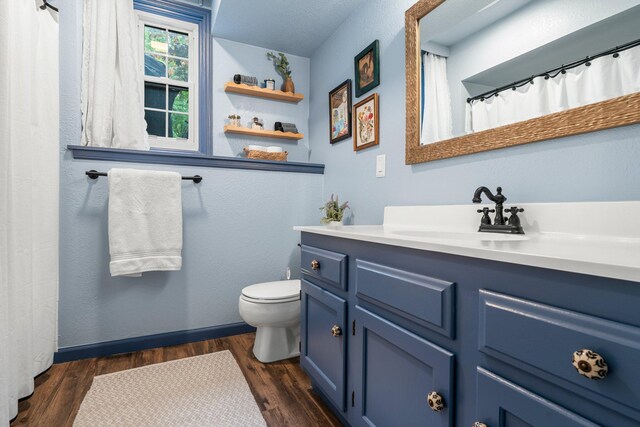 95 Olympic Cir, Chanhassen, MN 55317 - bathroom with toilet, wood finished floors, and vanity