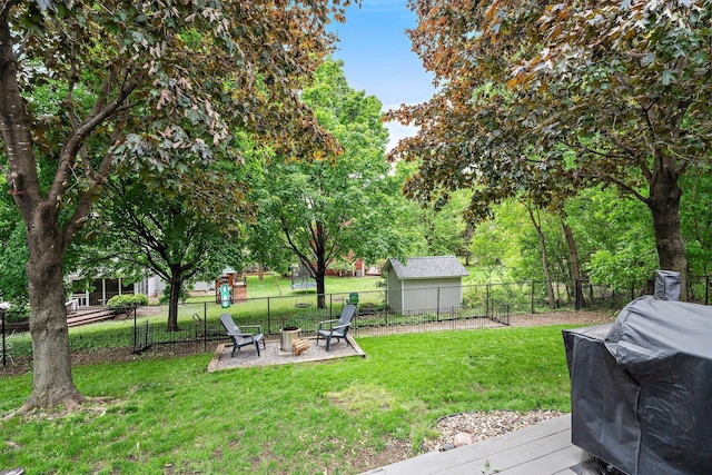 95 Olympic Cir, Chanhassen, MN 55317 - view of yard featuring an outdoor fire pit and a deck