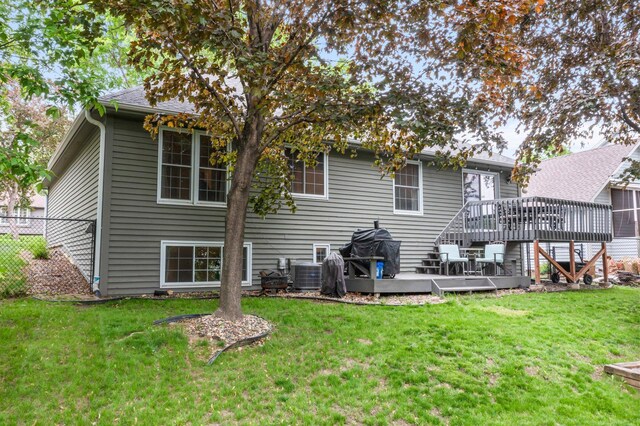 95 Olympic Cir, Chanhassen, MN 55317 - back of house featuring a wooden deck, stairs, and central AC unit