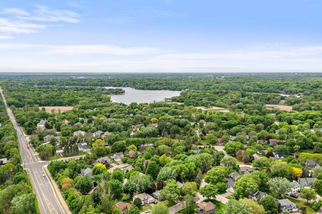 95 Olympic Cir, Chanhassen, MN 55317 - aerial view of residential area featuring a nearby body of water and a heavily wooded area
