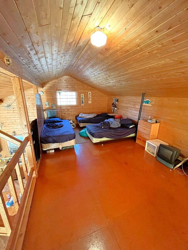 17353 Pine Dr NW, Angle Inlet, MN 56711 - bedroom with wooden ceiling, wood walls, vaulted ceiling, and concrete floors