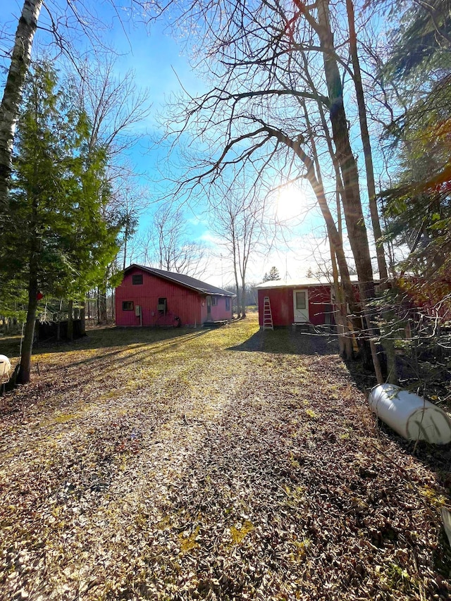17353 Pine Dr NW, Angle Inlet, MN 56711 - view of yard with an outdoor structure
