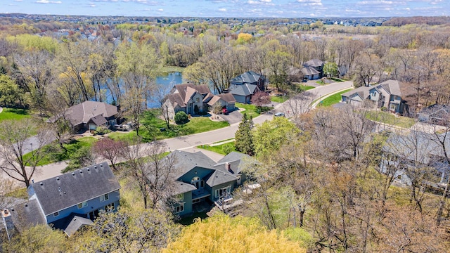 bird's eye view featuring a view of trees and a residential view