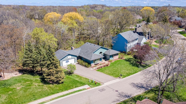 aerial view featuring a wooded view