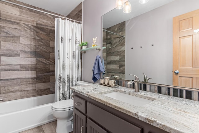 bathroom with shower / bath combo with shower curtain, toilet, and vanity