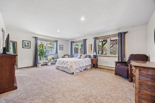 bedroom featuring carpet, a textured ceiling, baseboard heating, recessed lighting, and baseboards