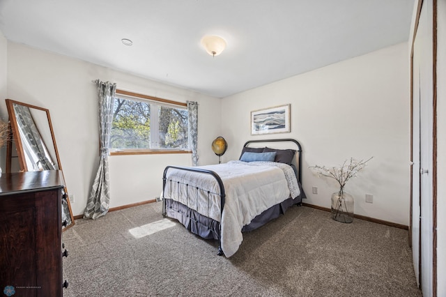 carpeted bedroom featuring baseboards