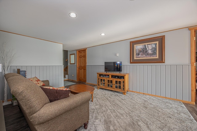living area featuring wainscoting and recessed lighting