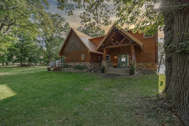 4224 Thunder Lake Lodge Dr NE, Remer, MN 56672 - log cabin with stone siding, a front yard, a metal roof, and faux log siding