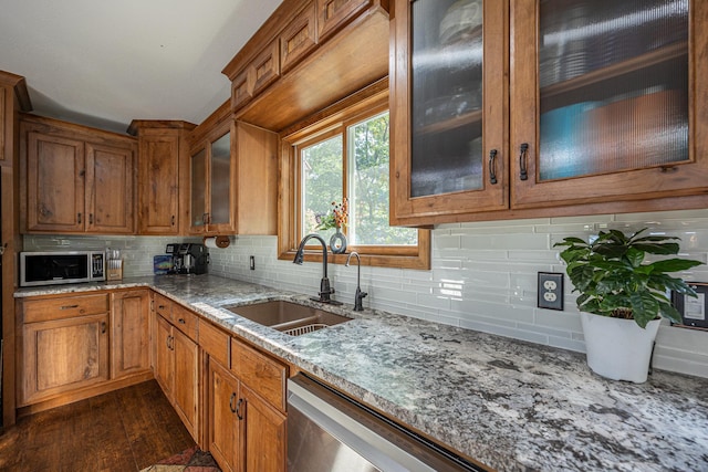 4224 Thunder Lake Lodge Dr NE, Remer, MN 56672 - kitchen with stainless steel appliances, brown cabinets, light stone countertops, and decorative backsplash