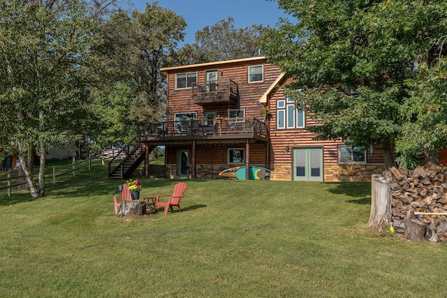 4224 Thunder Lake Lodge Dr NE, Remer, MN 56672 - rear view of property with stairway, a wooden deck, a balcony, stone siding, and faux log siding