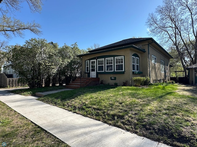 911 8th St N, Fargo, ND 58102 - view of side of home with stucco siding
