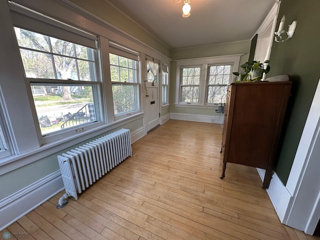 911 8th St N, Fargo, ND 58102 - sunroom featuring radiator heating unit