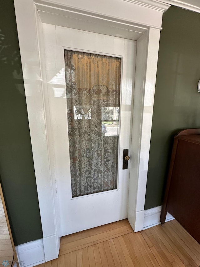 911 8th St N, Fargo, ND 58102 - doorway to outside with wood finished floors