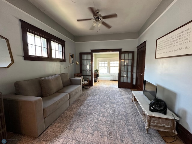 911 8th St N, Fargo, ND 58102 - living room featuring radiator heating unit and ceiling fan