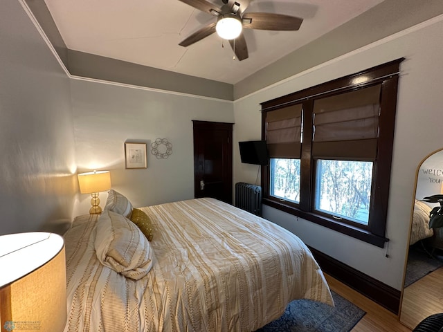 911 8th St N, Fargo, ND 58102 - bedroom featuring a ceiling fan and wood finished floors
