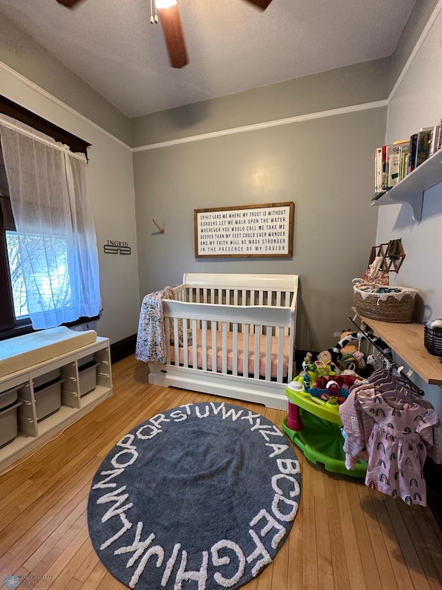 911 8th St N, Fargo, ND 58102 - bedroom with wood-type flooring and a ceiling fan