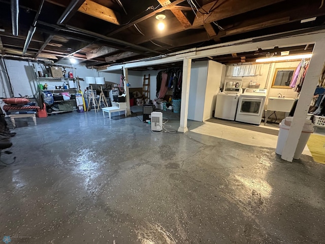 911 8th St N, Fargo, ND 58102 - unfinished below grade area with independent washer and dryer and a sink