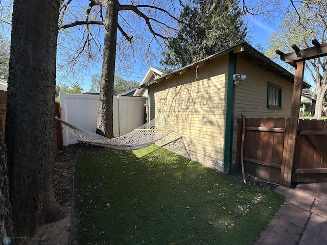911 8th St N, Fargo, ND 58102 - view of side of property with a gate and fence
