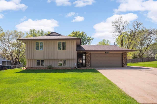 11438 Zea St NW, Coon Rapids, MN 55433 - tri-level home featuring an attached garage, concrete driveway, board and batten siding, and stone siding