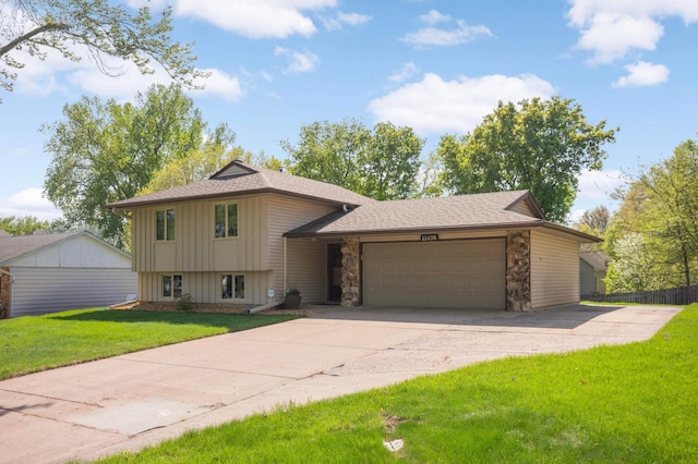 11438 Zea St NW, Coon Rapids, MN 55433 - split level home with board and batten siding, stone siding, an attached garage, driveway, and a front yard