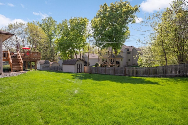 11438 Zea St NW, Coon Rapids, MN 55433 - view of yard with a shed, stairway, a wooden deck, and an outdoor structure