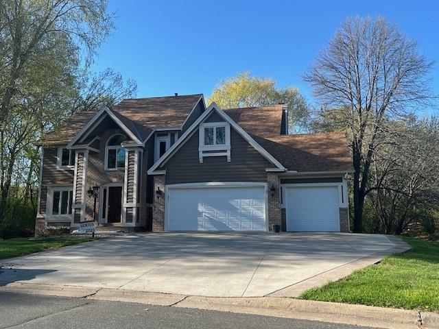 view of front of home with an attached garage and driveway