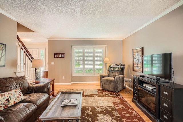 1237 Summit Oaks Dr, Burnsville, MN 55337 - living room featuring light wood-style flooring, ornamental molding, a textured ceiling, healthy amount of natural light, and stairs