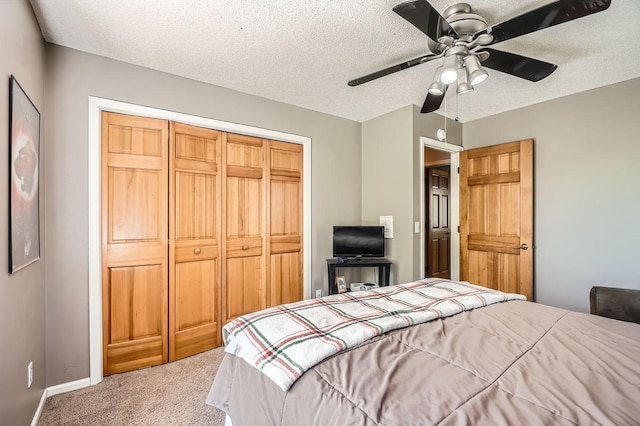 1237 Summit Oaks Dr, Burnsville, MN 55337 - carpeted bedroom with a closet, a textured ceiling, and ceiling fan