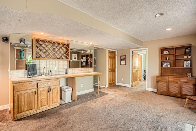 1237 Summit Oaks Dr, Burnsville, MN 55337 - indoor wet bar with a textured ceiling, carpet flooring, tasteful backsplash, and recessed lighting