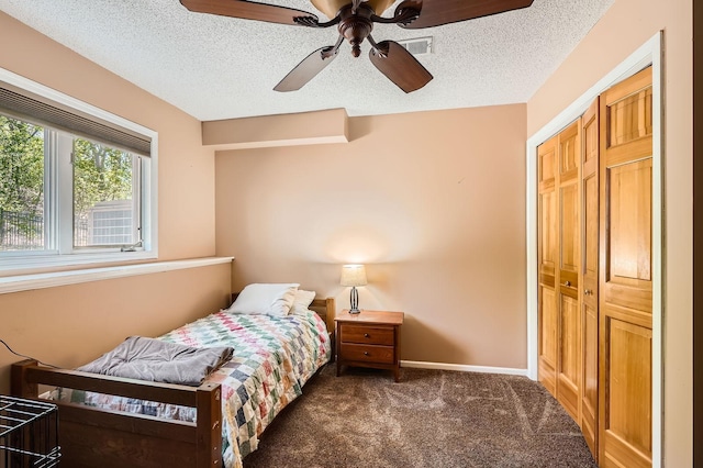 1237 Summit Oaks Dr, Burnsville, MN 55337 - carpeted bedroom with a textured ceiling, a closet, and a ceiling fan