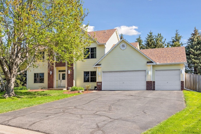 view of front of property with brick siding, driveway, a garage, and a shingled roof