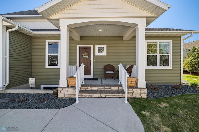 entrance to property with roof with shingles