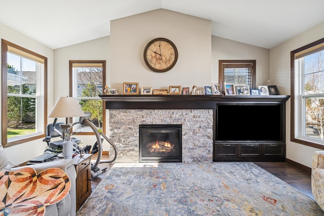 living room with lofted ceiling, wood finished floors, a fireplace, and baseboards