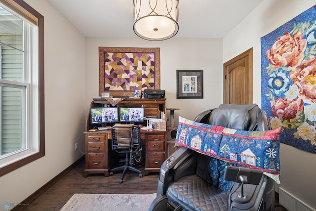 bedroom with dark wood-style flooring, an office area, and baseboards